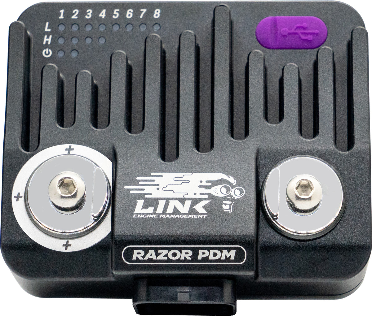 Link Razor PDM, top view of the finned aluminium case with the two power studs and output indicator LEDs.