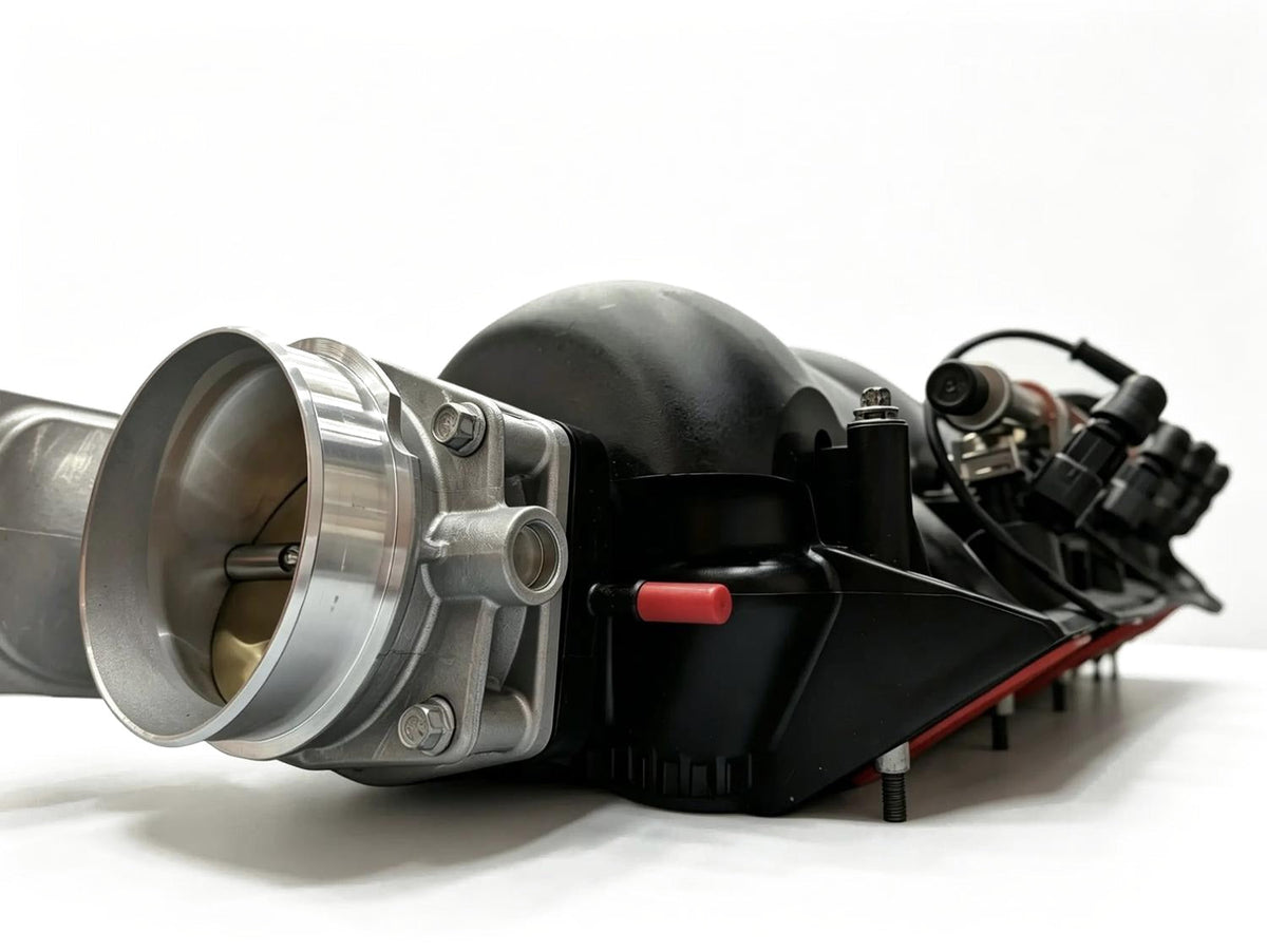 LS intake manifold and billet throttle body with the Faustec harness injector branch connected along the fuel rail.